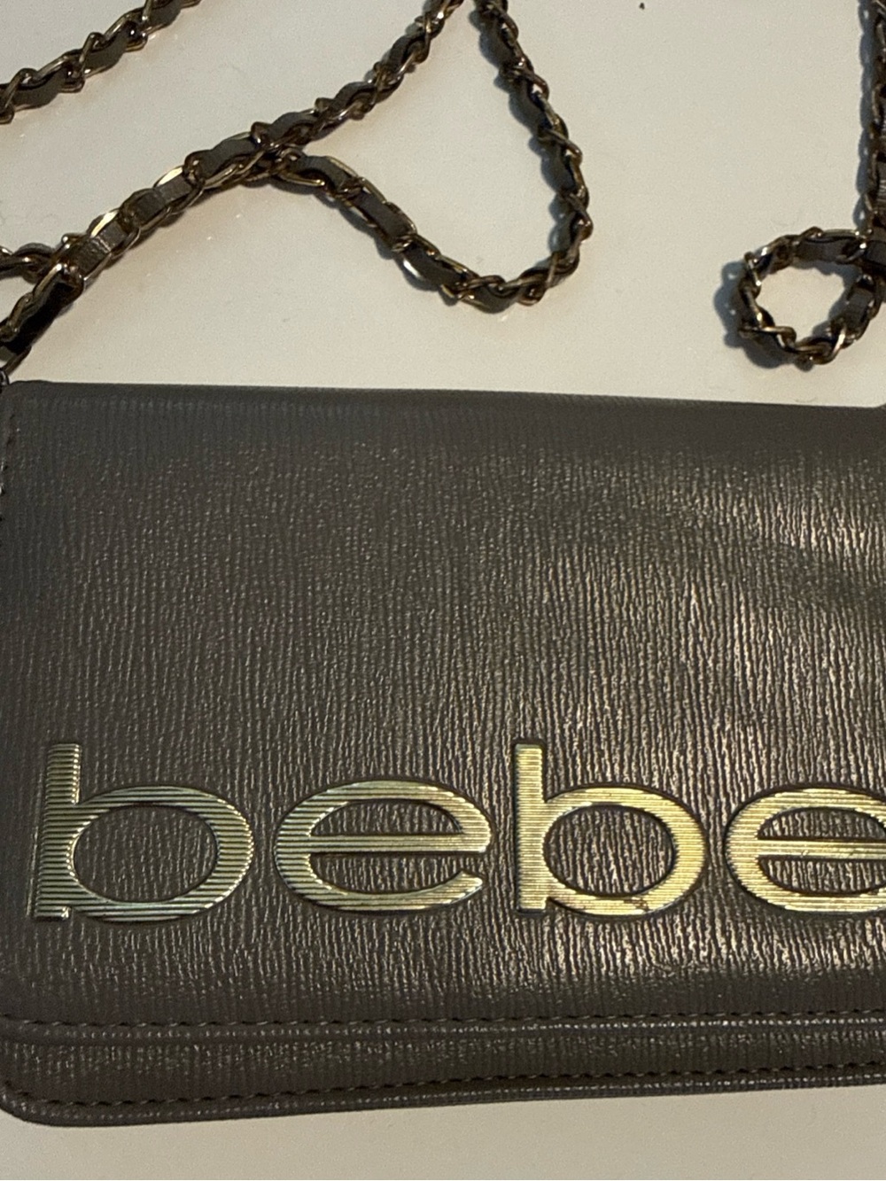 bebe Charcoal Gray Crossbody Clutch with Gold Logo